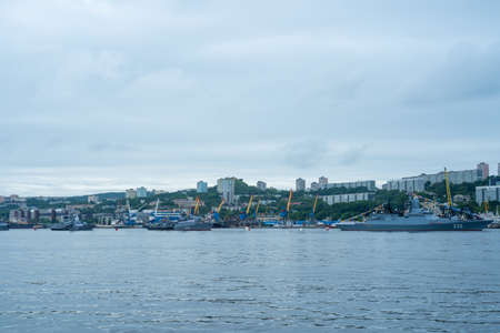 Vladivostok, Russia - July 26, 2020: Warships on the background of the urban landscape. Day of the Navy.のeditorial素材