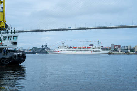 Vladivostok, Russia - July 26, 2020: Warships on the background of the urban landscape. Day of the Navy.のeditorial素材