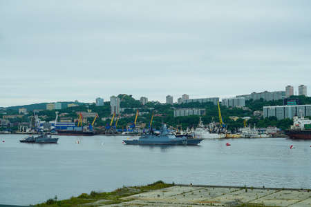 Vladivostok, Russia - July 26, 2020: Warships on the background of the urban landscape. Day of the Navy.のeditorial素材