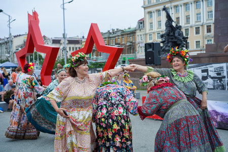 Vladivostok, Russia - July 26, 2020: Portraits of elderly women against the backdrop of the city landscape on a holiday.のeditorial素材