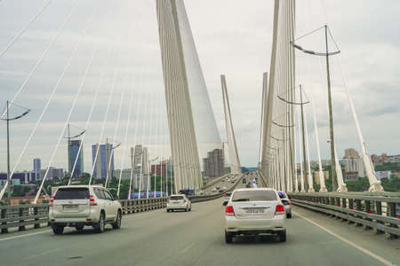 Vladivostok, Russia - July 26, 2020: City landscape with a view of traffic on the Golden Bridge.のeditorial素材