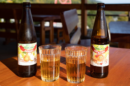 Slyudyanka, Irkutsk region - September 16, 2020: bottles and glasses with lemonade on a wooden tableのeditorial素材