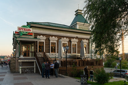 Irkutsk, Russia-September 18, 2020: Urban landscape with views of wooden houses on a pedestrian street.のeditorial素材