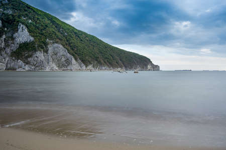 Seascape with views of mountains and ships. Long exposure.の写真素材