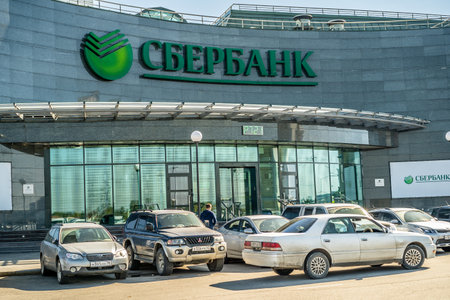 Irkutsk, Russia-September 17, 2020: Urban landscape with a view of the building. The inscription on the facade of the "Sberbank"のeditorial素材