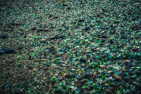 Natural background with sea glass close-up on sand. Vladivostok, Glass beach.の写真素材