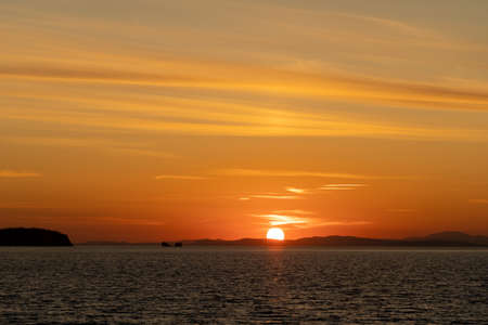 Seascape with a beautiful sunset on the horizon. Amur Bay, Vladivostokの写真素材