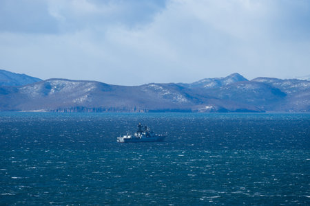 Seascape with a warship in Avacha Bay. Kamchatka, Russia