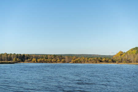 Natural landscape with a lake and autumn trees on the shore. Travel, tourismの写真素材
