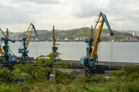 Nakhodka, Primorsky Krai - September 25, 2020: Seascape with a view of the port cranes.のeditorial素材