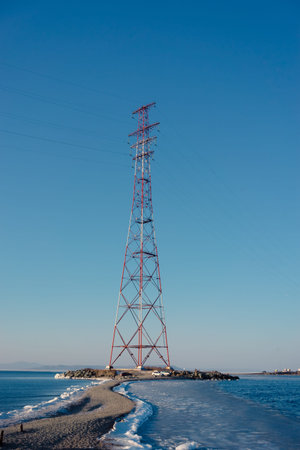 High-voltage tower against the blue sky. Vladivostok, Russia