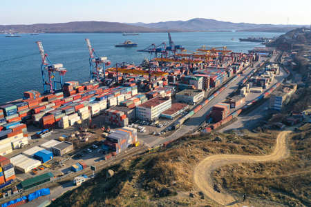 Vladivostok, Russia-April 12, 2020: Industrial landscape with a view of the commercial port on the background of the city.のeditorial素材