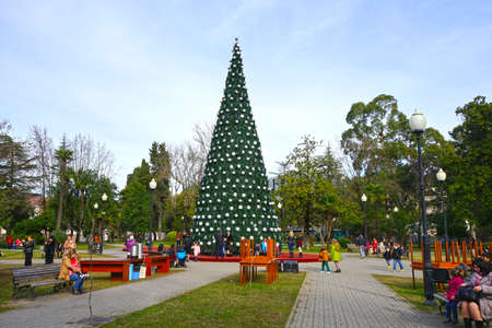 Sukhum, Abkhazia - December 21, 2014: Urban landscape with a Christmas tree and people on the squareのeditorial素材