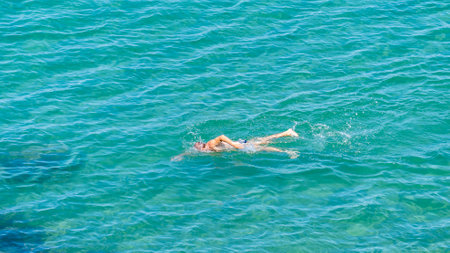 Water surface with a floating man.のeditorial素材