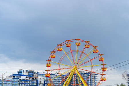 Sevastopol, Russia-June 17, 2021: Ferris wheel on the background of the apartment buildingのeditorial素材