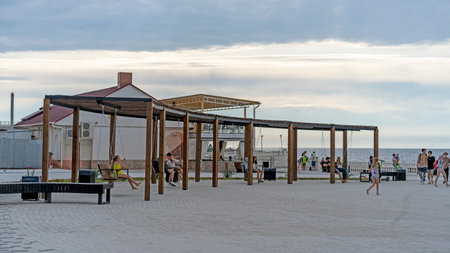 Sevastopol, Russia-June 17, 2021: Landscape with a view of the recreation area and vacationing people on the city embankmentのeditorial素材