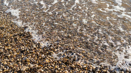 Natural background with sea wave and white foam.の写真素材