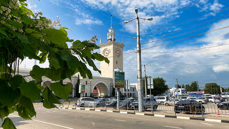 Simferopol, Crimea-June 23, 2021: City landscape with a view of the railway station building.のeditorial素材