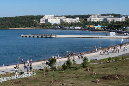 Vladivostok, Russia-September 5, 2021 :: The WEF Exhibition on the Russian Island. Far East Street. People are walking along the embankment.のeditorial素材
