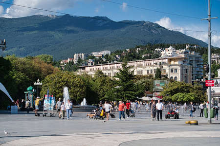 Yalta, Crimea-June 8, 2021: Urban landscape with a view of the embankment of the city and people.のeditorial素材
