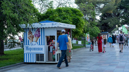 YALTA, Crimea-June 12, 2021: Urban landscape with a view of an ice cream stand and peopleのeditorial素材