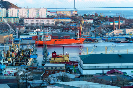 Vladivostok, Russia - December 24, 2021: Industrial landscape with a view of the Diomidovsky port...