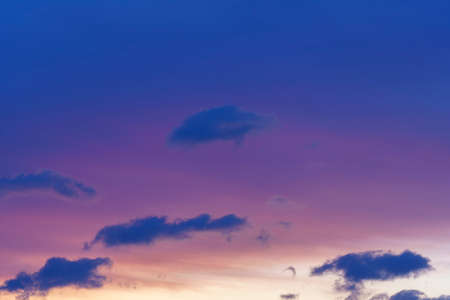 Beautiful purple background with evening sky and clouds.の写真素材