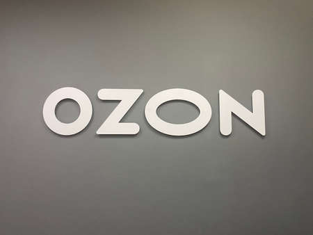Vladivostok, Russia - May 10, 2021: OZON logo on a gray wallのeditorial素材
