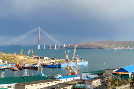 Vladivsotok, Russia - May 7, 2022: Seascape overlooking the port and the Russian Bridge.のeditorial素材