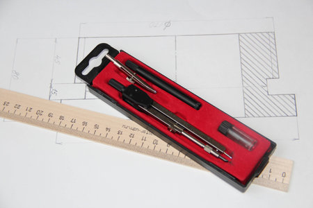 compasses and the ruler on the drawing background