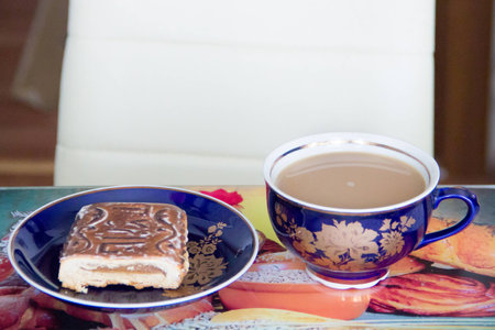 cup of coffee and saucer with a stickの写真素材