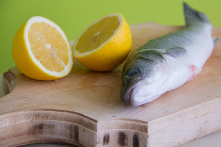 fish seabass and sliced lemonの写真素材