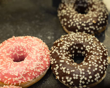 Dark chocolate donuts. Restaurant traditional american sweet cakesの写真素材