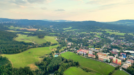 A stunning aerial view that beautifully captures the lush greenery and charming town nestled among...