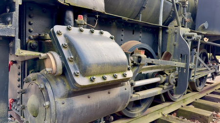 This is a closeup detailed view of a vintage steam locomotives intricate engine components and...