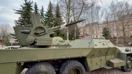 This photo shows a closeup of a military vehicle equipped with an advanced antiaircraft artillery...