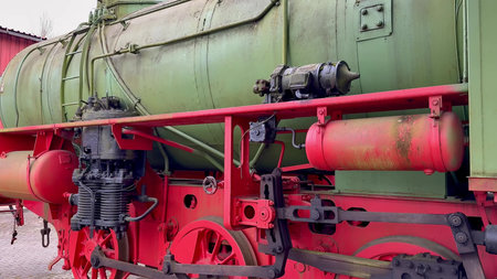 An intricate and detailed view of an old steam locomotive proudly showing its vibrant and colorful...