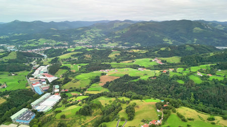 Breathtaking aerial views showcasing vibrant green fields, rolling hills, and charming picturesque...