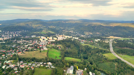 A stunning aerial landscape beautifully depicting a serene and peaceful valley alongside a...