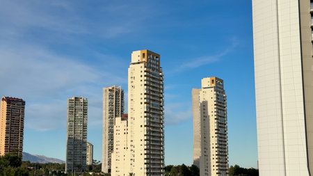 A breathtaking and stunning view of sleek, tall highrise buildings standing majestically against a...