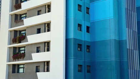 This stylish urban building showcases a striking and unique combination of vibrant colors alongside...