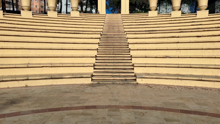 An incredibly beautiful amphitheater featuring welldefined steps, decorative artistic columns, and...