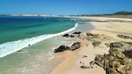 A stunning beach view that beautifully showcases the clear turquoise waters along with soft golden sandの写真素材