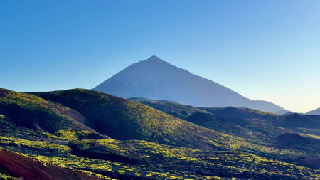 Embark on an adventure to explore stunning volcanic terrain, vibrant vegetation, magnificent mountains, and landscapesの写真素材