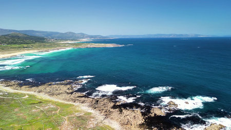 Stunning coastal vistas present breathtaking views of turquoise waters combined with picturesque rocky shorelinesの写真素材