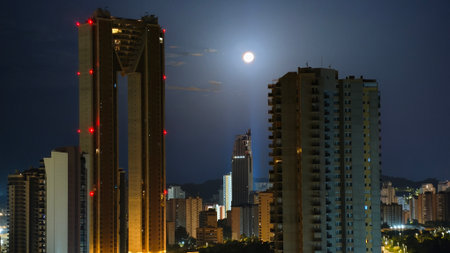 Cityscape of Hong Kong at night with full moon in the skyの写真素材
