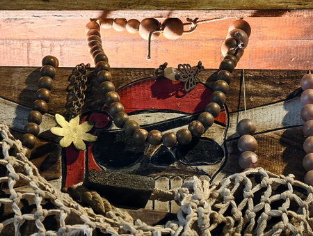 This captivating piratethemed artwork beautifully features an assortment of beads, nets, and an...