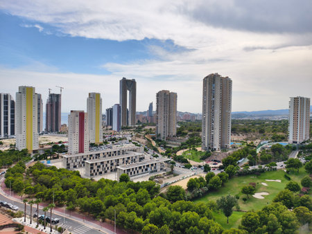 A captivating view of a stunning urban skyline with greenery and modern buildings reflecting a vibrant lifestyleの写真素材