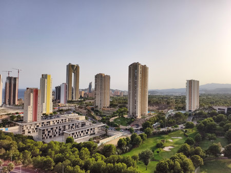 Aerial view of a city with multiple skyscrapers and urban development.の写真素材