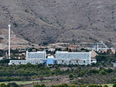 A stunning hotel nestled in a breathtaking mountainous landscape, offering serene views and embracing natureの写真素材